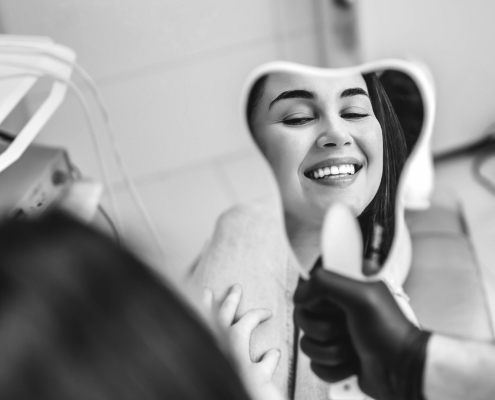 Woman Smiling in Dental Office